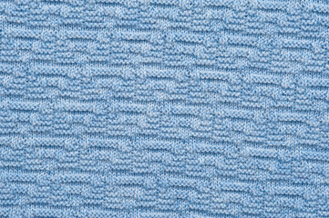 Close-up fragment of warm knitted blue sweatshirts. Concept of warm everyday things. clothing store concept. Advertising space