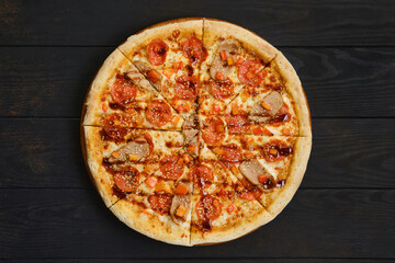 Pizza with pepperoni, ham, bell pepper and sesame