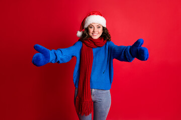 Portrait of her she nice attractive pretty cheerful cheery kind girl wearing festal Santa look hugging you invitation isolated bright vivid shine vibrant red color background