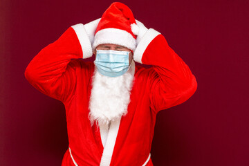 Santa Claus keep his head closed eyes medical mask making a stop gesture with his hands
