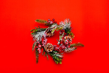 Christmas wreath, on red bright background. top view,Christmas composition.