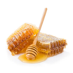 Honeycomb with honey spoon isolated on white background