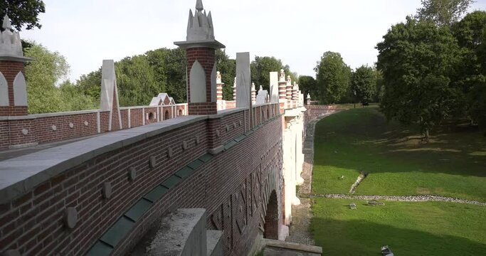 4K high quality sunny spring day video footage of famous Moscow Tsaritsyno Estate built during rein of Czarina Katherine 2 The Great with visitors and panorama of green park in the capital of Russia