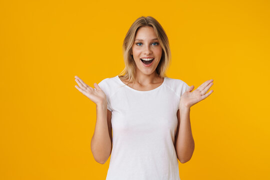 Excited beautiful girl exclaiming with throwing up hands