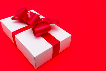 Top view White gift box ribbon flat lay red background.Christmas concept.
