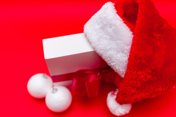 Obraz na płótnie Canvas Christmas white present with santa hat closeup