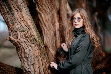 model late autumn in the park, european style adult girl in seasonal glamorous look