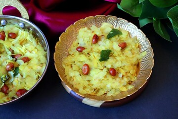 Poha Chivda or Chiwada. Diwali special savory snack, made out of Flattened rice, fried peanuts, curry leaves and some spices. Traditional Indian Diwali Snacks.  with Copy Space.