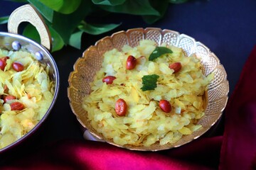 Poha Chivda or Chiwada. Diwali special savory snack, made out of Flattened rice, fried peanuts, curry leaves and some spices. Traditional Indian Diwali Snacks.  with Copy Space.