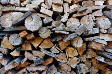 Wooden logs,boards, firewood. Harvesting firewood for the winter. Lumber for furniture making....