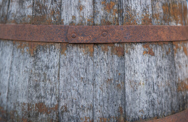 Wooden barrel on a table and textured background