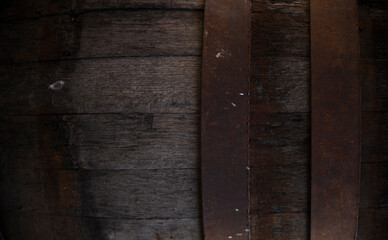 Wooden barrel on a table and textured background