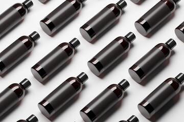 Pattern made of cosmetic amber glass bottles with blank black label. Top view over white background.