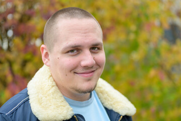 Relaxed young man with a warm friendly smile