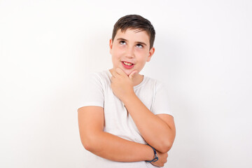 Caucasian young boy standing against white background  smiling friendly offering something with open hand or handshake as greeting and welcoming. Successful business.