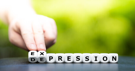 Hand turns dice and changes the word 