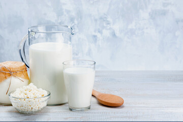 Assortment of dairy products on wooden table with copy space.