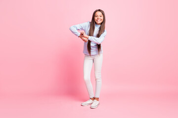 Fototapeta na wymiar Full length body size view of pretty glad cheerful girl dancing enjoying free time isolated over pink pastel color background