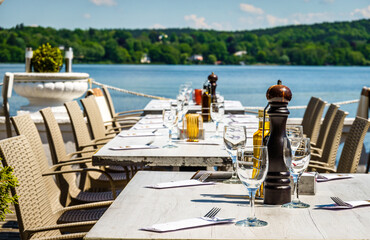 table and chairs at a sidewalk restaurant