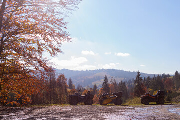 Extreme fun off-road ATV ride through the autumn mountains © svitlini