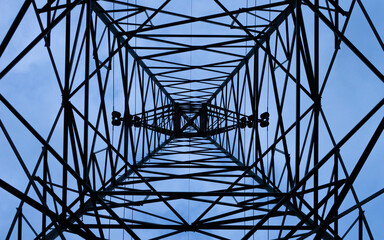 Bottom view high voltage tower Daytime blue sky background High technology