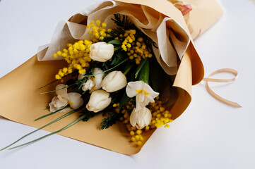 Bouquet of flowers in beige package