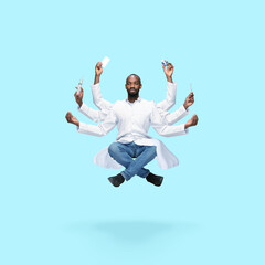 Handsome african doctor, multi-armed man levitating isolated on blue studio background with...