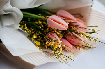 Close-up bouquet of flowers in beige package
