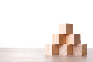 Obraz premium Wall Wooden Block Cubic On white Background. Wooden Block on table with Copy Space.