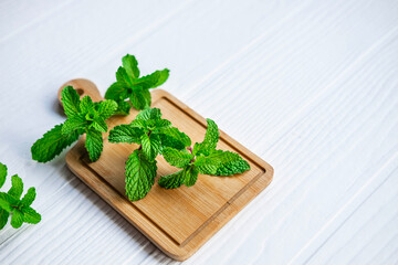 Fresh mint herbs on wooden table