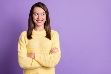 Fototapeta premium Photo portrait of young beautiful girl smiling with crossed hands wearing yellow outfit looking at copyspace isolated on vibrant violet background