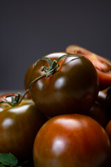 Fresh ripe sweet reddish brown and green kumato tomatoes