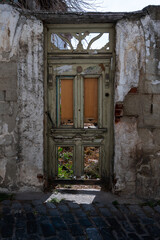 Fototapeta na wymiar Old broken wooden door in Kavala, Greece