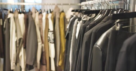 clothes rail with stylishly fashionable clothes in a minimalist fashion label in 4k