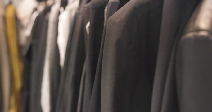 clothes rail with stylishly fashionable clothes in a minimalist fashion label in 4k