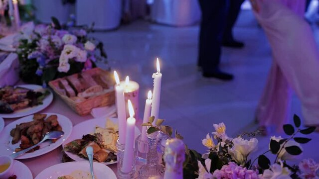 candles burn in the evening on a table