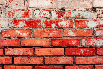 Texture of a brick wall with cracks and scratches which can be used as a background