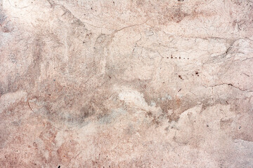 Texture of a concrete wall with cracks and scratches which can be used as a background