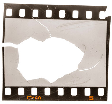 damaged blank 35mm filmstrip with ripped frame cell on white background.