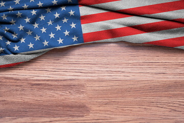Crumpled of United states of America or USA flag on wooden background.