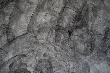 The cement wall is painted in black, loft style.