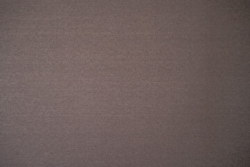 A brown background image with many small dots.