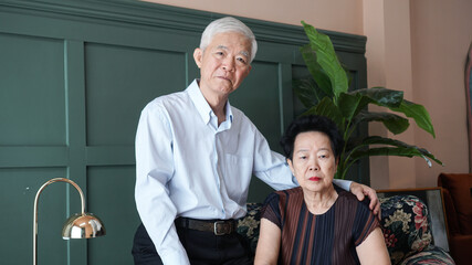 Smart business Asian senior couple happy together in luxury interior house