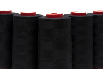 Black thread for sewing on a white background