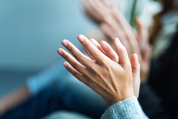 Closeup image of people clapping hands together