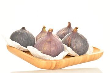 Fototapeta premium Ripe dark blue organic figs, close-up, on a white background.