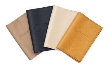 Leather covers for passport, handcrafted work. Brown, white, yellow, beige colors on a white background