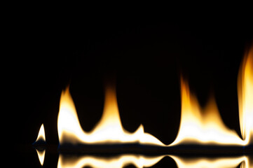 The fire. Flames are burning isolated on a black background.