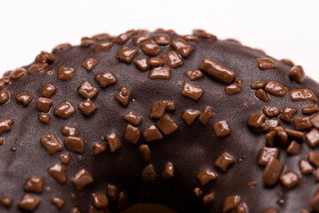 Chocolate donut on a white background close-up.
