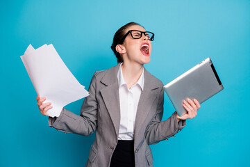 Portrait of attractive fury crazy devastated lady specialist managing documentation scream yell isolated on bright blue color background